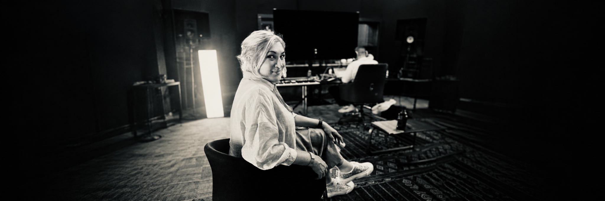 Larissa Tormey seated in a recording studio